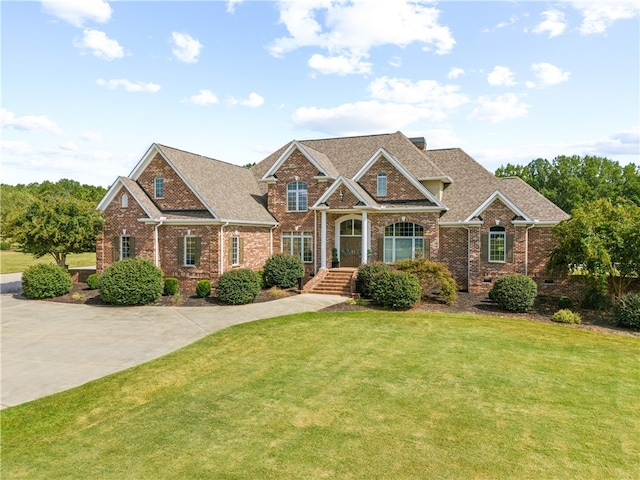 craftsman-style house with a front lawn