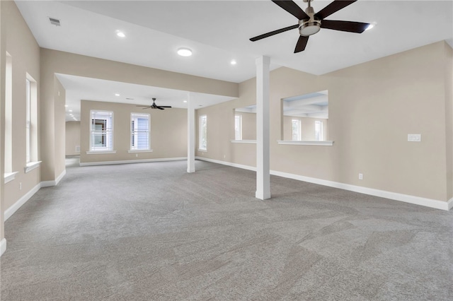 unfurnished living room with ceiling fan and light colored carpet