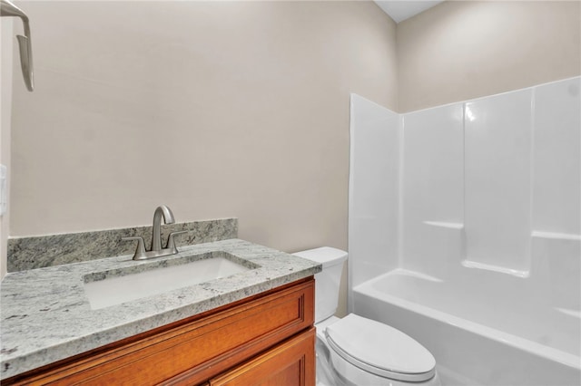 full bathroom with bathing tub / shower combination, vanity, and toilet