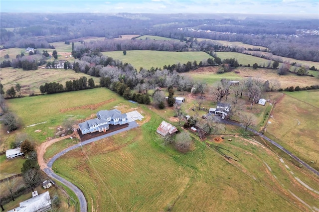 birds eye view of property with a rural view