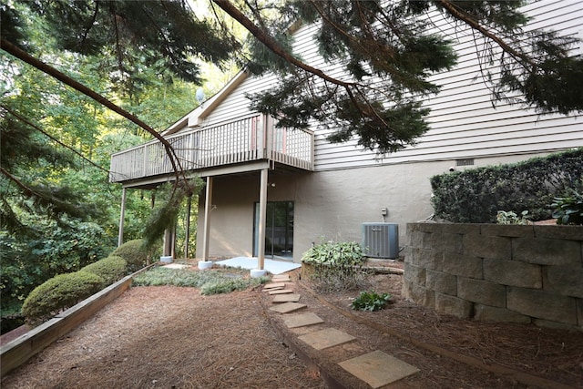 back of house featuring cooling unit