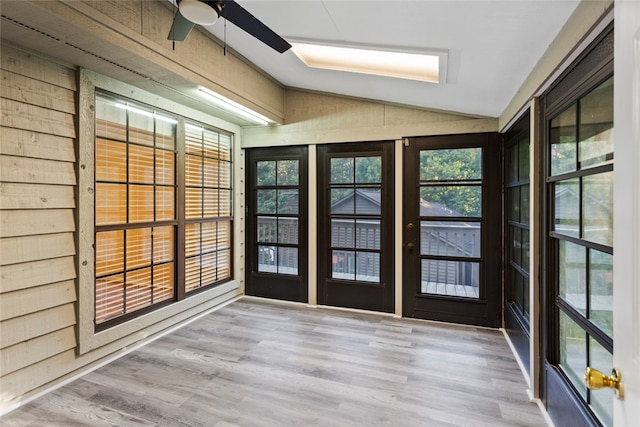 unfurnished sunroom featuring vaulted ceiling and ceiling fan