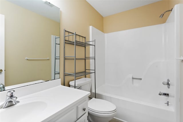 full bathroom featuring vanity, tub / shower combination, and toilet