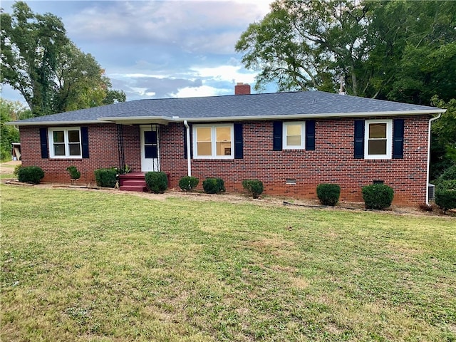 ranch-style home featuring a front yard