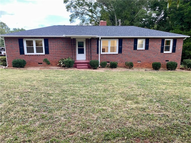 ranch-style house with a front lawn