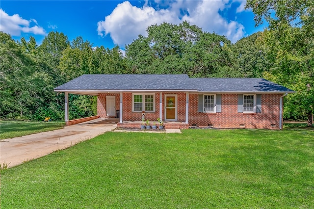 single story home with a front yard and a carport