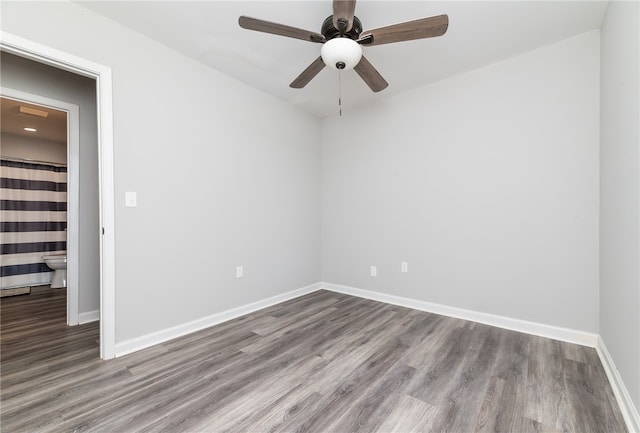 empty room featuring hardwood / wood-style floors and ceiling fan