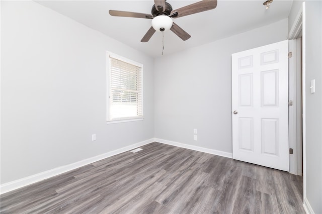 unfurnished room featuring ceiling fan and hardwood / wood-style floors