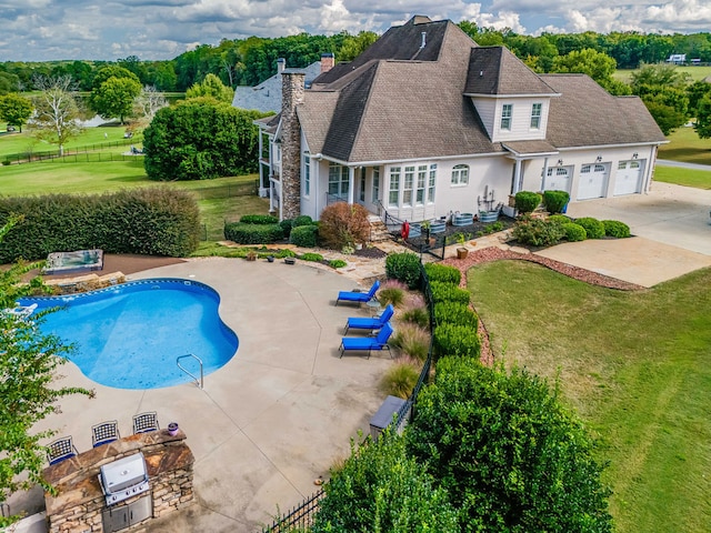 view of pool featuring a patio and a lawn