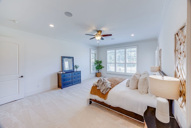 bedroom featuring ceiling fan, light carpet, and ornamental molding