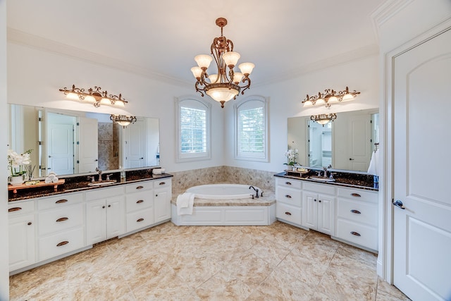 bathroom featuring a notable chandelier, vanity, ornamental molding, and a bath