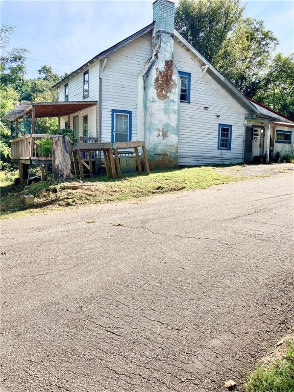 view of home's exterior with a wooden deck