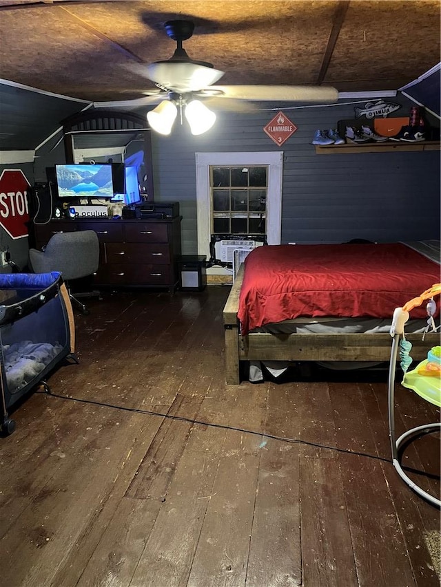 bedroom with wood-type flooring and a ceiling fan