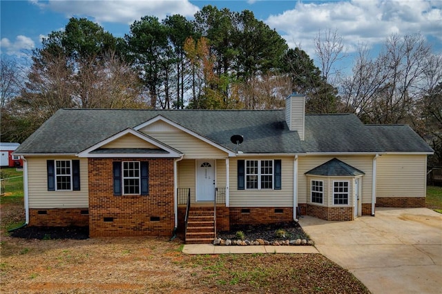 view of front facade featuring crawl space, a shingled roof, and a chimney