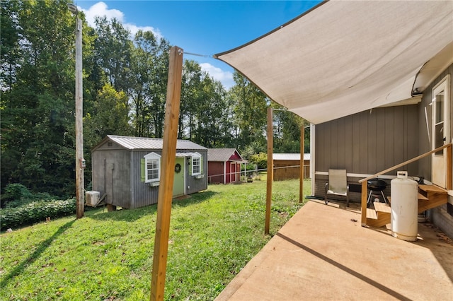 view of yard featuring a patio and a shed