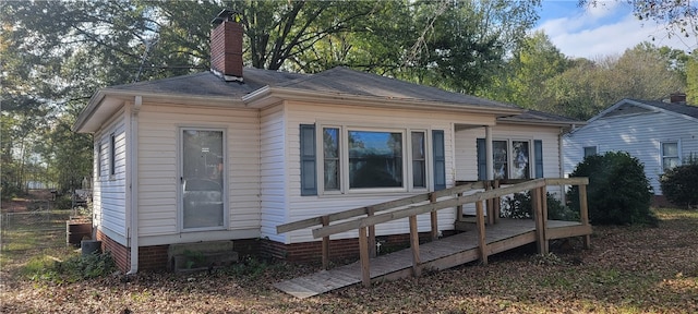 back of house with a deck