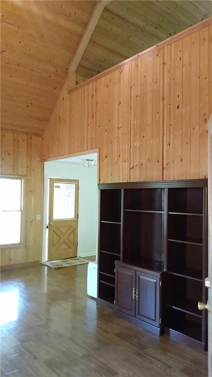 157 Deerwood Dr, Westminster, SC 29693 - unfurnished living room with wooden ceiling, wooden walls, lofted ceiling with beams, and wood finished floors