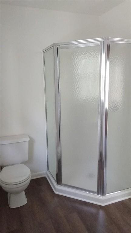 157 Deerwood Dr, Westminster, SC 29693 - bathroom featuring baseboards, a shower stall, toilet, and wood finished floors
