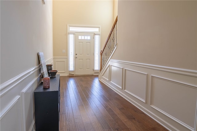 entrance foyer featuring dark hardwood / wood-style floors