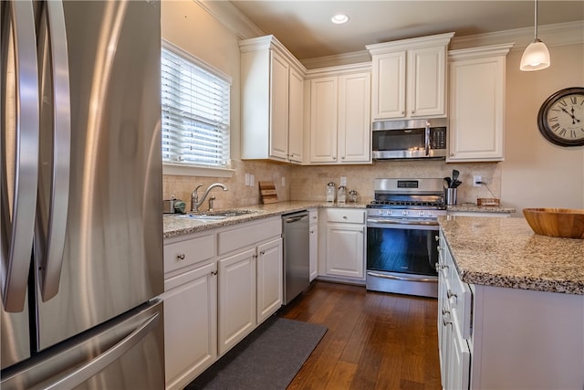 kitchen featuring white cabinetry, light stone countertops, stainless steel appliances, and dark hardwood / wood-style flooring