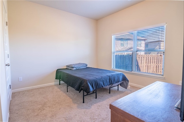 bedroom with light carpet