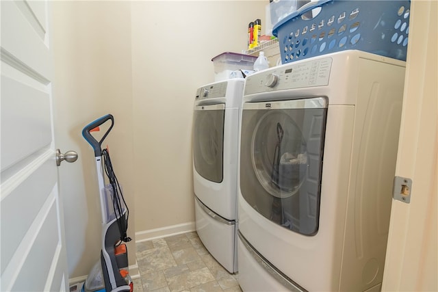 washroom with independent washer and dryer