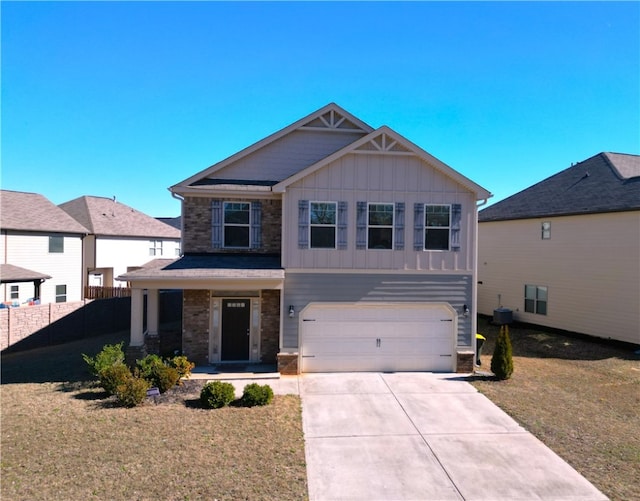 view of front of property with a garage and a front yard