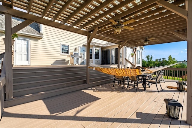 wooden deck with a pergola and ceiling fan