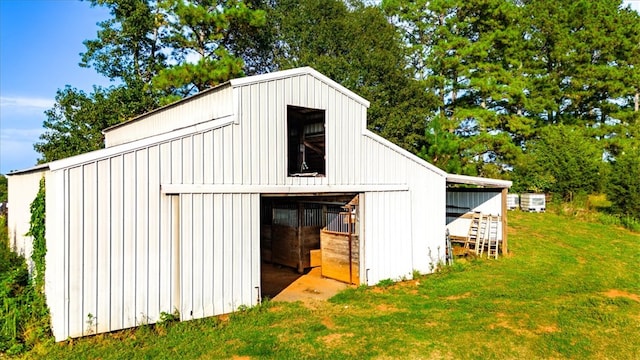 view of outbuilding with a yard