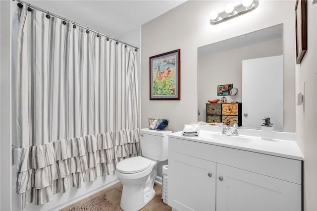 bathroom featuring tile patterned flooring, vanity, and toilet