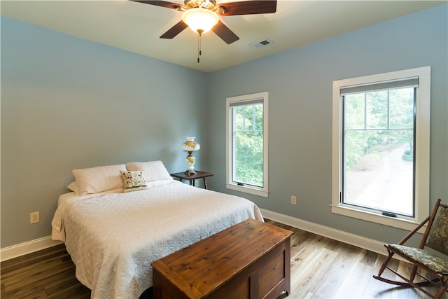 bedroom featuring hardwood / wood-style flooring and ceiling fan