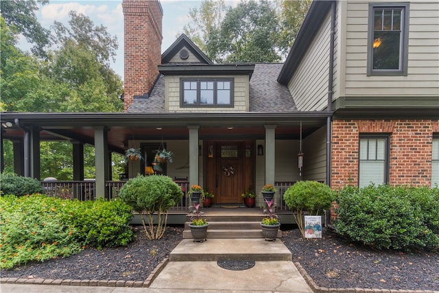 entrance to property with a porch