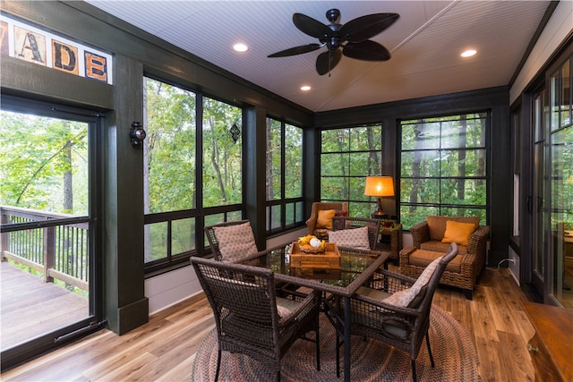 sunroom / solarium with wooden ceiling and ceiling fan