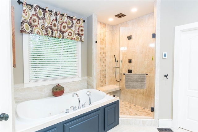 bathroom featuring tile patterned flooring and shower with separate bathtub