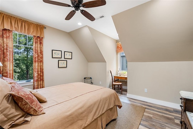 328 Grand Overlook Dr, Seneca, SC 29678 - bedroom with multiple windows, wood finished floors, a ceiling fan, baseboards, and vaulted ceiling