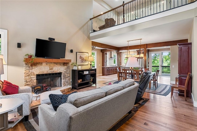 328 Grand Overlook Dr, Seneca, SC 29678 - living room with a towering ceiling, wood finished floors, a fireplace, and baseboards