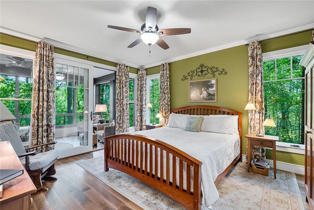 328 Grand Overlook Dr, Seneca, SC 29678 - bedroom featuring multiple windows, wood finished floors, ornamental molding, access to outside, and a ceiling fan