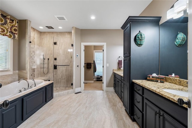 328 Grand Overlook Dr, Seneca, SC 29678 - bathroom with vanity, a stall shower, a bath, recessed lighting, and baseboards