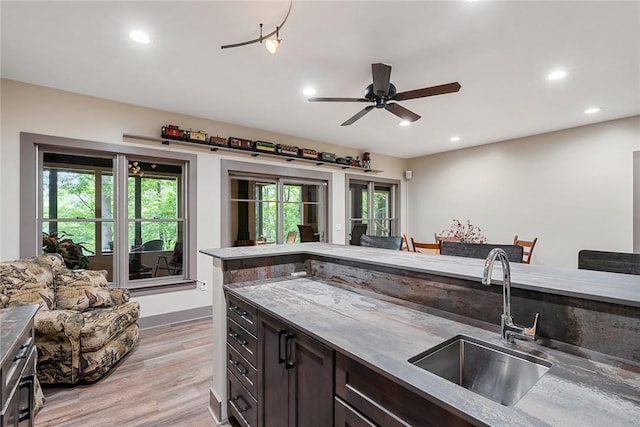 328 Grand Overlook Dr, Seneca, SC 29678 - kitchen featuring a sink, light wood-type flooring, recessed lighting, dark brown cabinets, and a ceiling fan