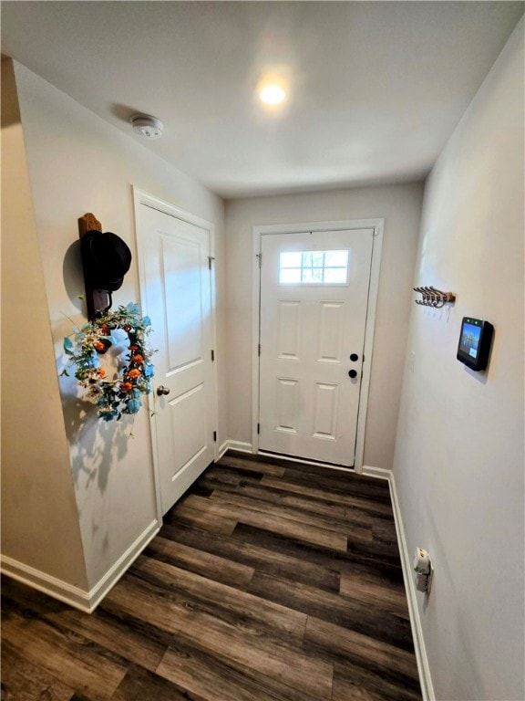 doorway to outside with dark hardwood / wood-style flooring