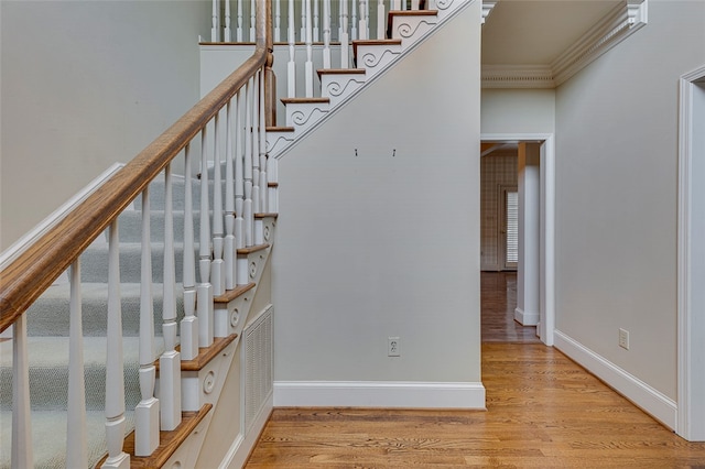 stairway featuring wood-type flooring