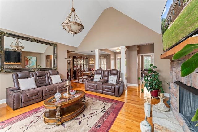 516 Serria Way, Seneca, SC 29678 - living area with ornate columns, high vaulted ceiling, wood finished floors, a fireplace, and baseboards