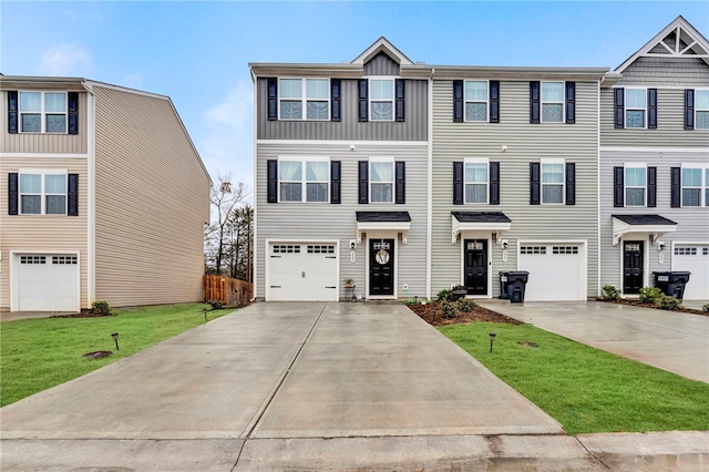 multi unit property featuring a front yard and a garage