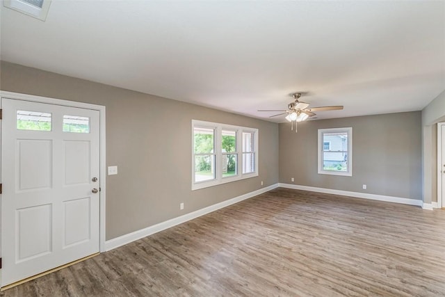 foyer featuring ceiling fan and light hardwood / wood-style flooring