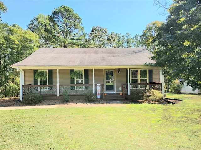 single story home with a front lawn and a porch