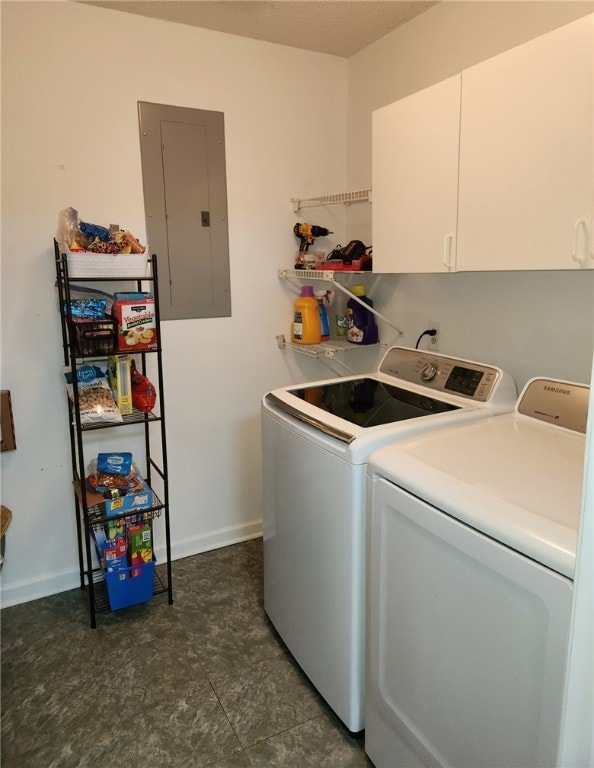 laundry room featuring cabinets, electric panel, and washer and dryer