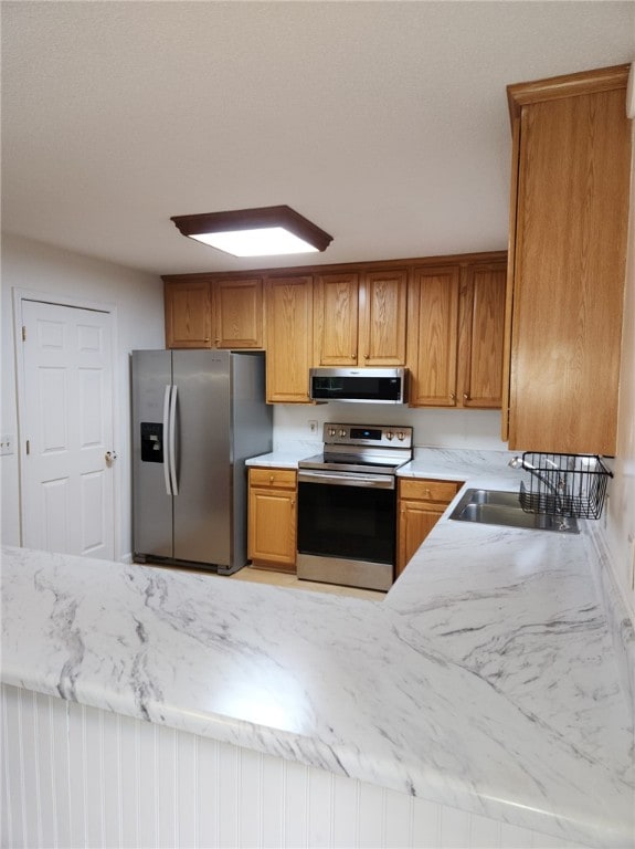 kitchen with appliances with stainless steel finishes and sink