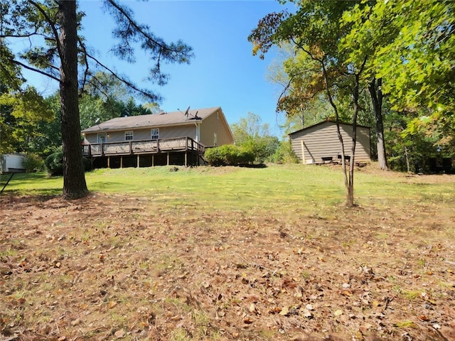 view of yard featuring a wooden deck