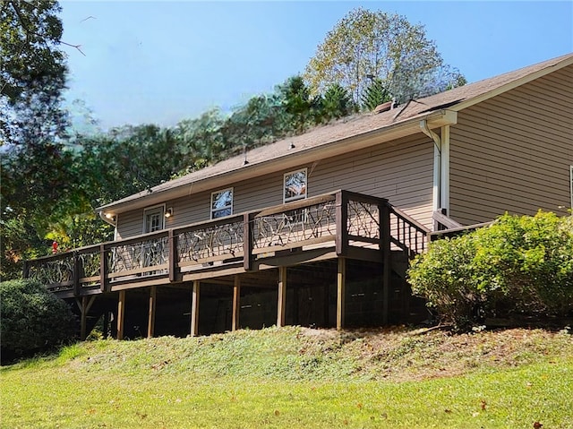 back of house with a deck and a yard