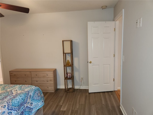 bedroom featuring ceiling fan and dark hardwood / wood-style flooring